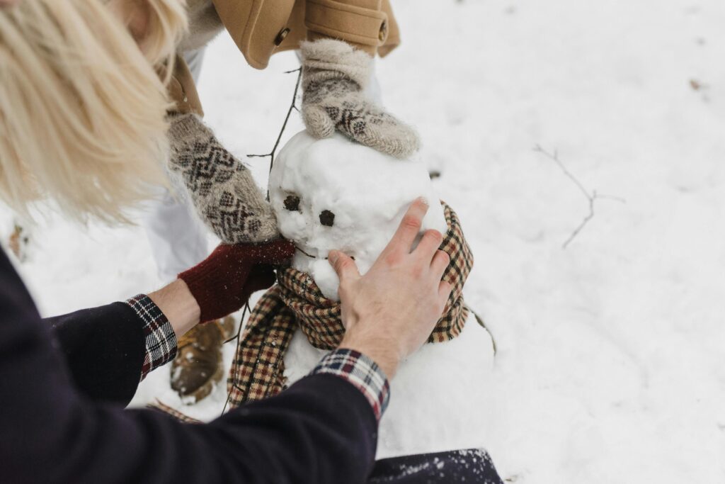 A list of 25 fun winter activities for families, including indoor and outdoor winter activities for preschoolers, toddlers, and kids. Activities include decorating the Christmas tree, writing letters to Santa, baking cookies, sledding, creating DIY ornaments, and making snow globes. These ideas are perfect for creating family traditions and embracing the holiday spirit while keeping kids engaged.