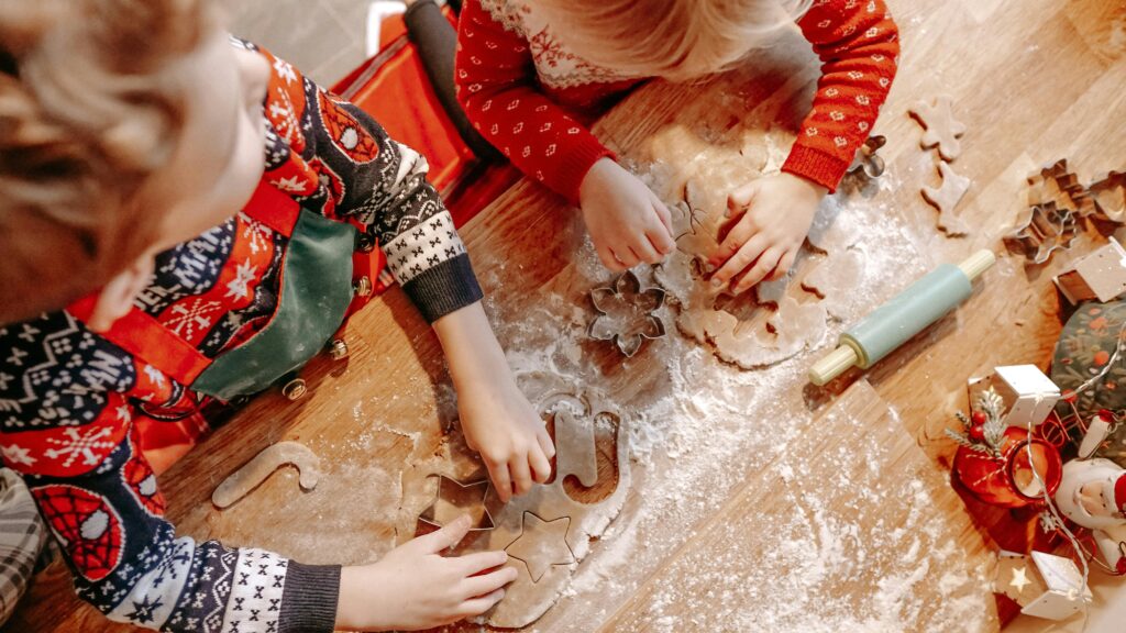 A list of 25 fun winter activities for families, including indoor and outdoor winter activities for preschoolers, toddlers, and kids. Activities include decorating the Christmas tree, writing letters to Santa, baking cookies, sledding, creating DIY ornaments, and making snow globes. These ideas are perfect for creating family traditions and embracing the holiday spirit while keeping kids engaged.