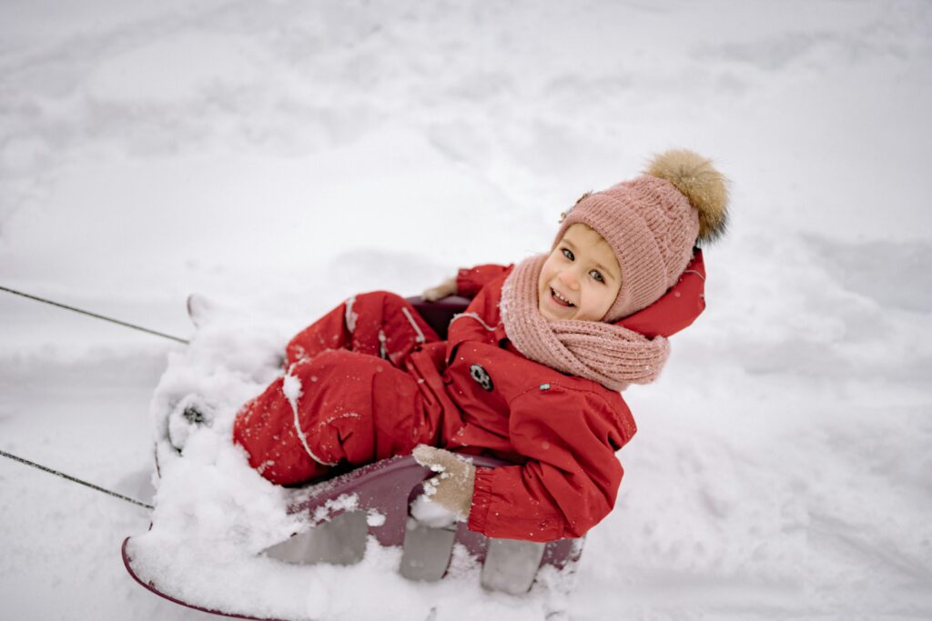 A list of 25 fun winter activities for families, including indoor and outdoor winter activities for preschoolers, toddlers, and kids. Activities include decorating the Christmas tree, writing letters to Santa, baking cookies, sledding, creating DIY ornaments, and making snow globes. These ideas are perfect for creating family traditions and embracing the holiday spirit while keeping kids engaged.